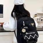 کوله‌پشتی مشکی با آویز خرسی و نوشته Keep A Good Mood